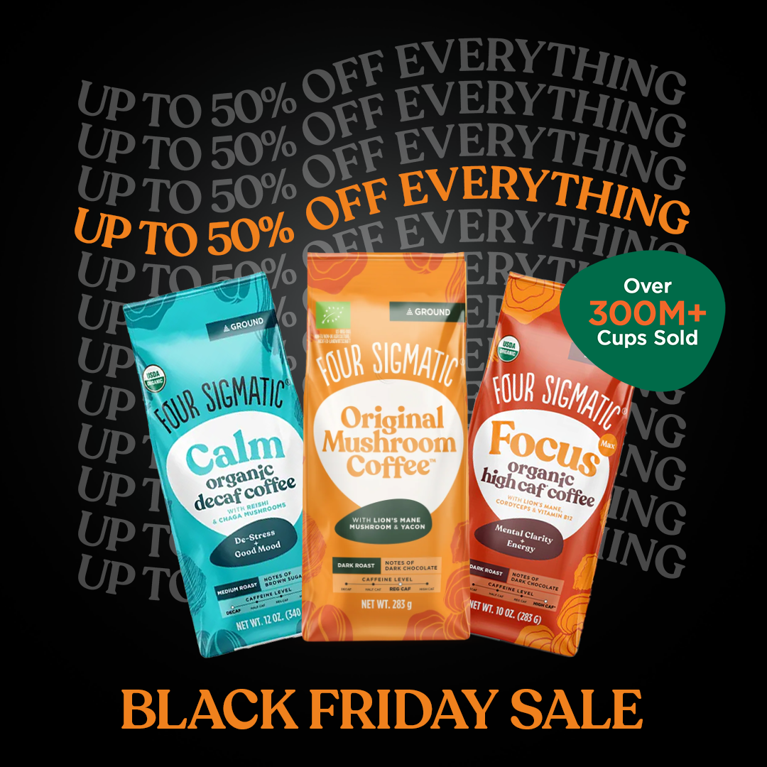 Four Sigmatic Black Friday ad: black background with Up To 50% Off Everything repeated as a text wall behind three coffee bags